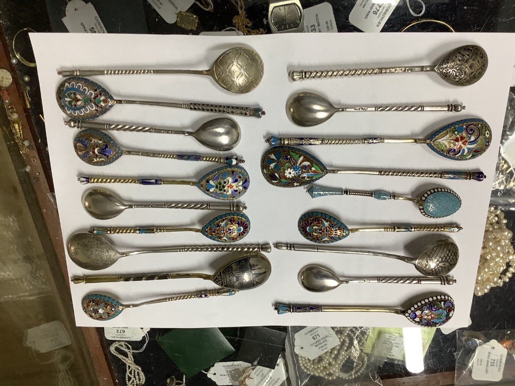 A small collection of Russian and Russian style white metal spoons etc, some with enamel or niello decoration.